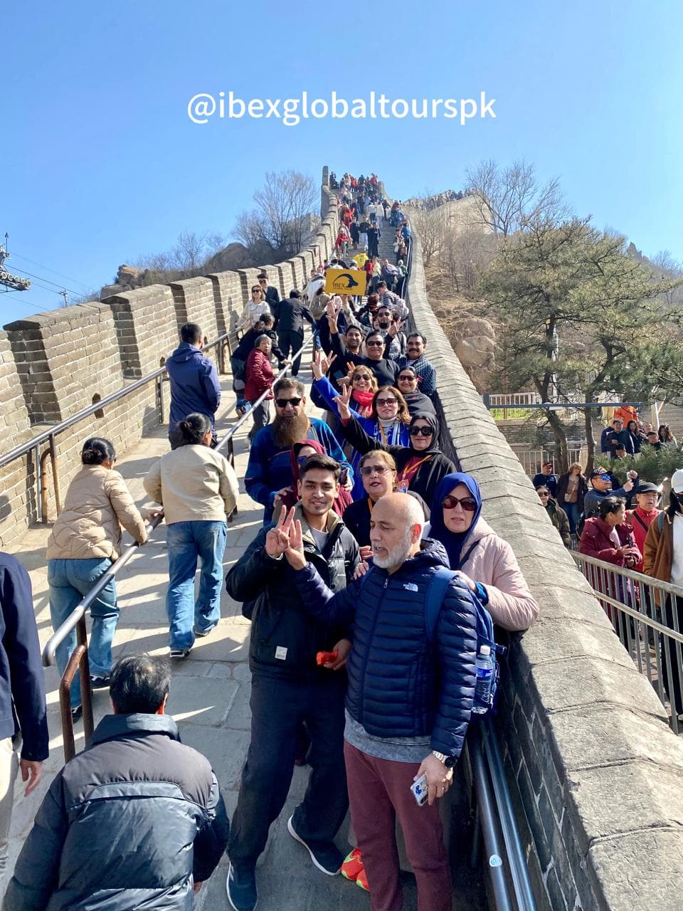 An IBEX group climbing the Great Wall of China